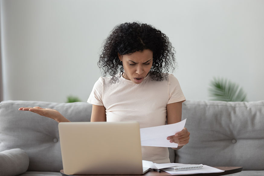 Woman looking at surprise bill